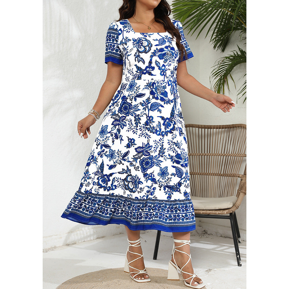 White maxi dress with blue floral print, square neckline, ideal for elegant occasions