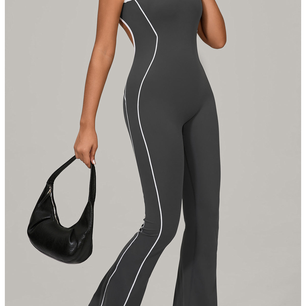 Lululemon Beauty Back Yoga Jumpsuit in charcoal gray with white piping