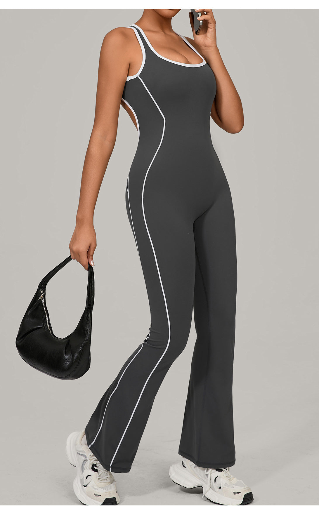 Lululemon Beauty Back Yoga Jumpsuit in charcoal gray with white piping