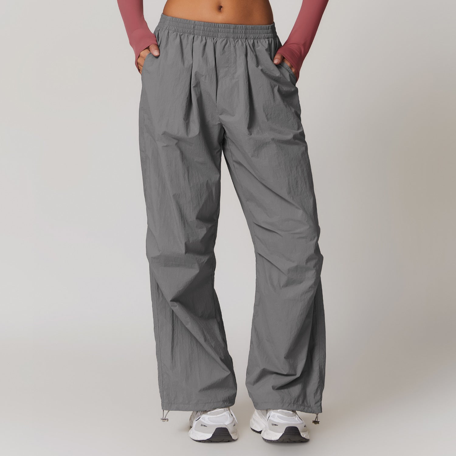 Gray drawstring parachute pants from Casual Sports Pants for stylish fitness fashion ملابس