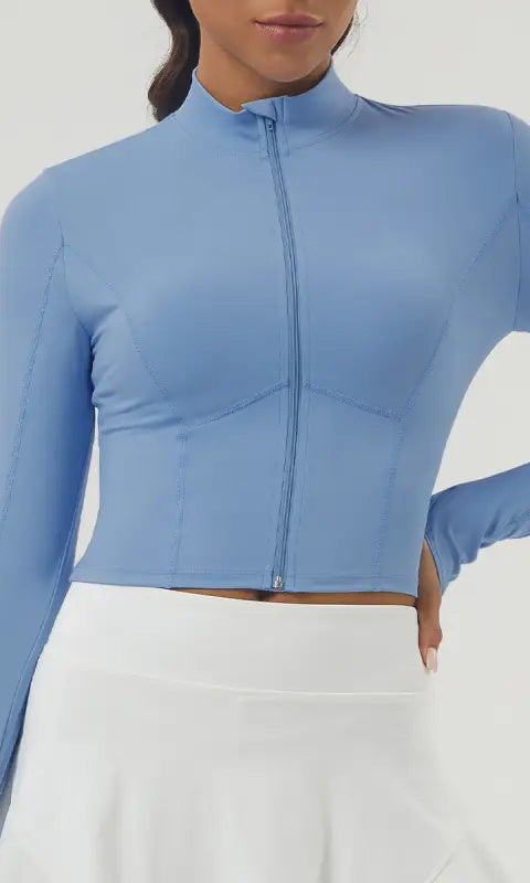Light blue long sleeve sports jacket with full-zip mock neck crop top
