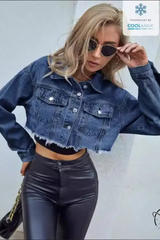 Woman in matching denim short coat with leather pants