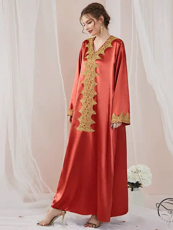 Elegant embroidered langry abaya in flowing red satin with gold details