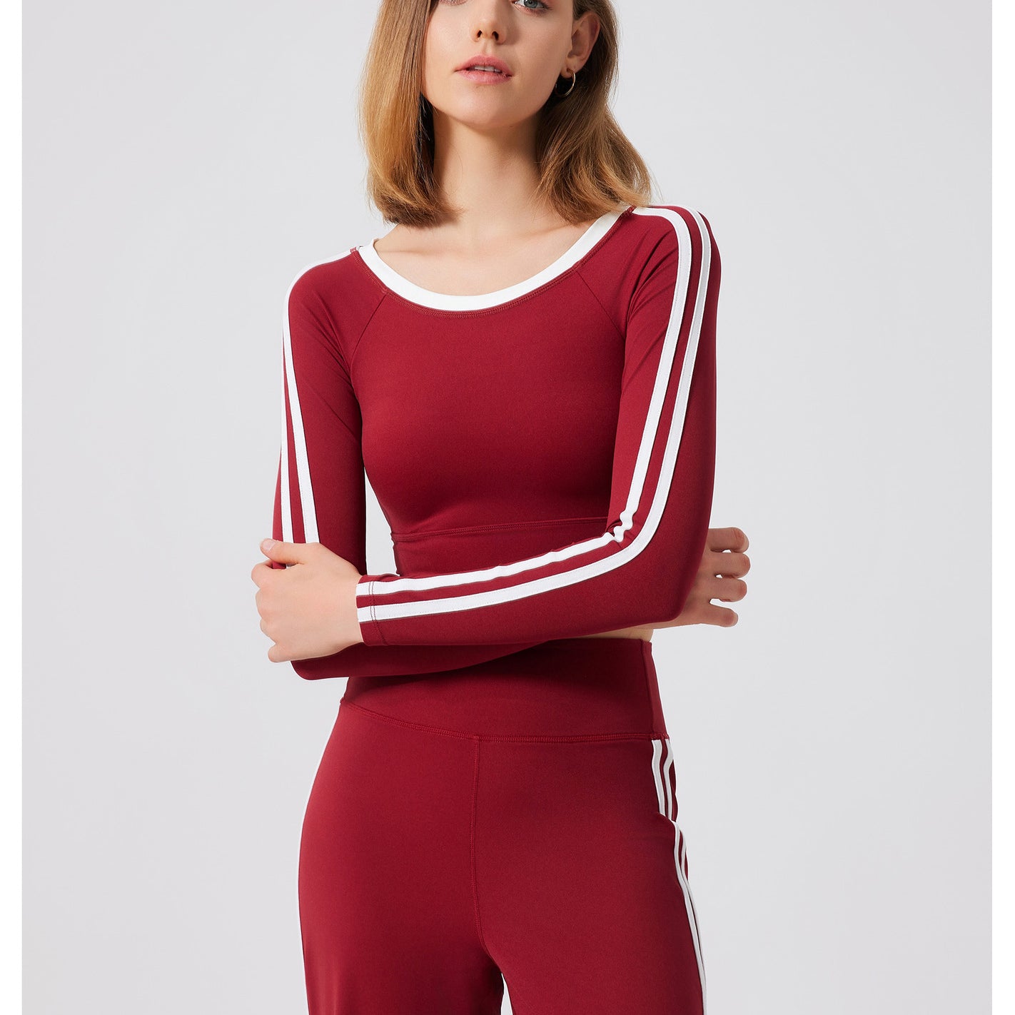 Burgundy long-sleeved athletic set with white stripes from Quick Drying Sports Top, perfect for fashionable ملابس