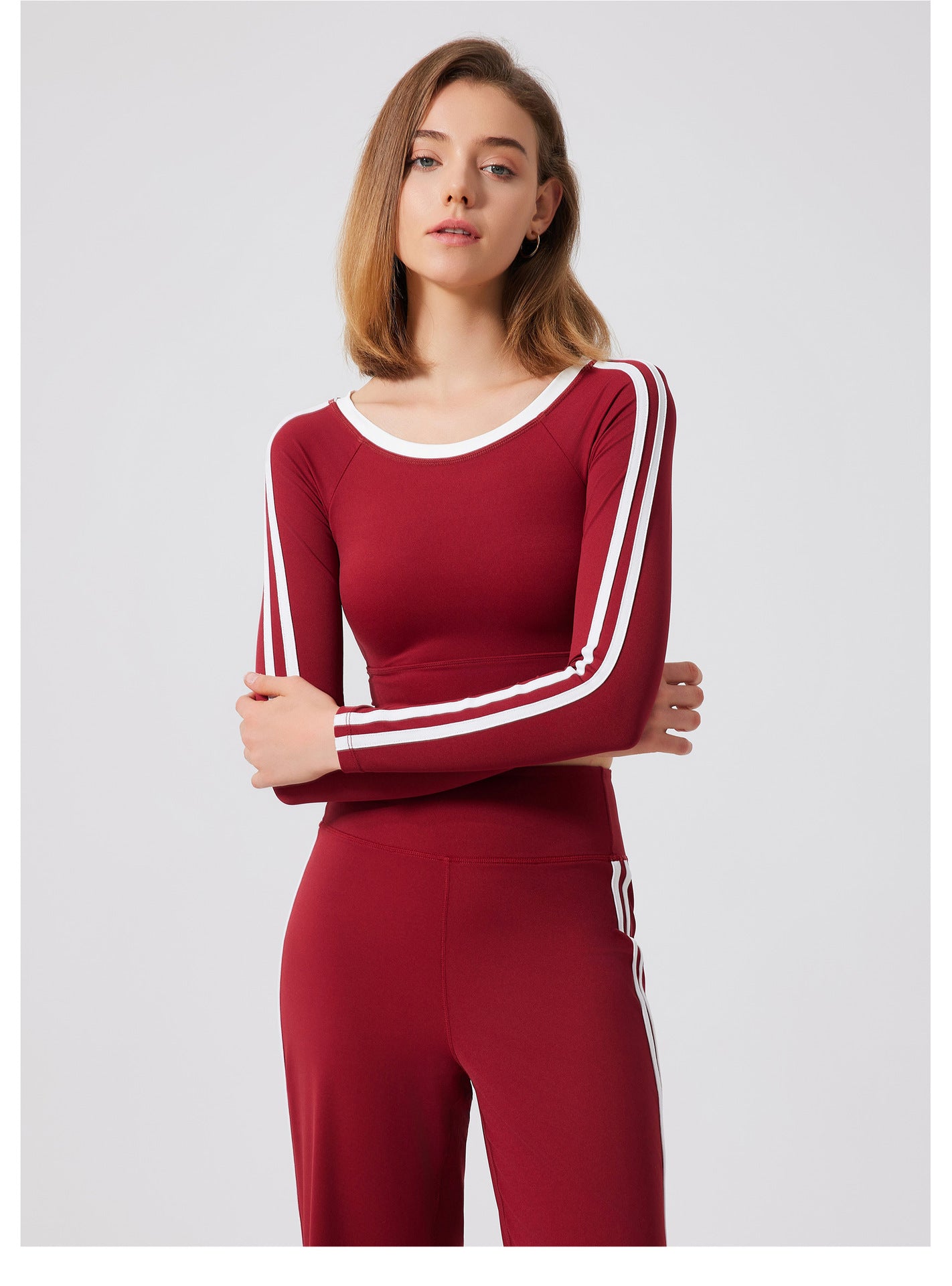 Burgundy long-sleeved athletic set with white stripes from Quick Drying Sports Top, perfect for fashionable ملابس