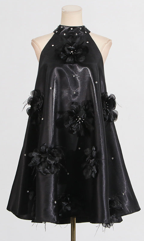 Black halter dress with floral embellishments, a stylish choice in ملابس fashion