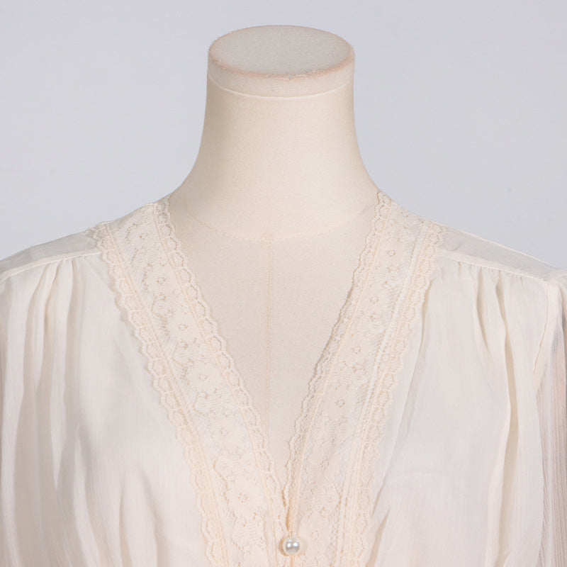 Cream-colored blouse with lace trim showcasing elegant langry fashion and ملابس style