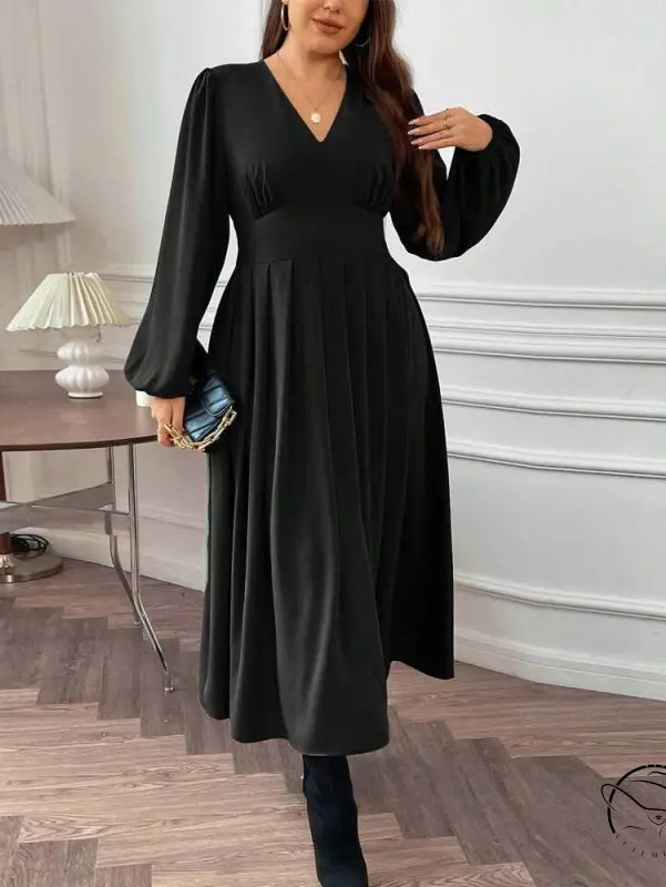 Woman in gorgeous large swing dress with voluminous sleeves and clutch