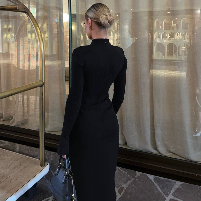 Elegant black midi dress featuring a beautiful back slit, perfect for contemporary fashion