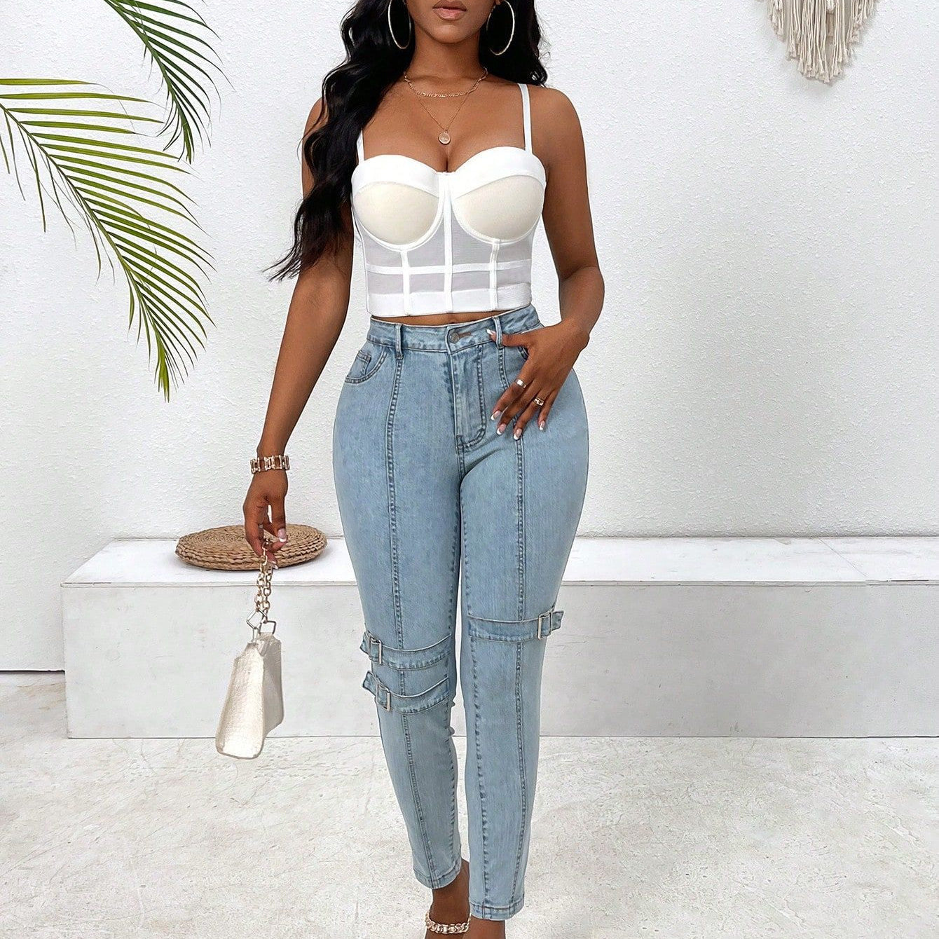 Woman wearing high elastic skinny jeans in white top and light blue denim