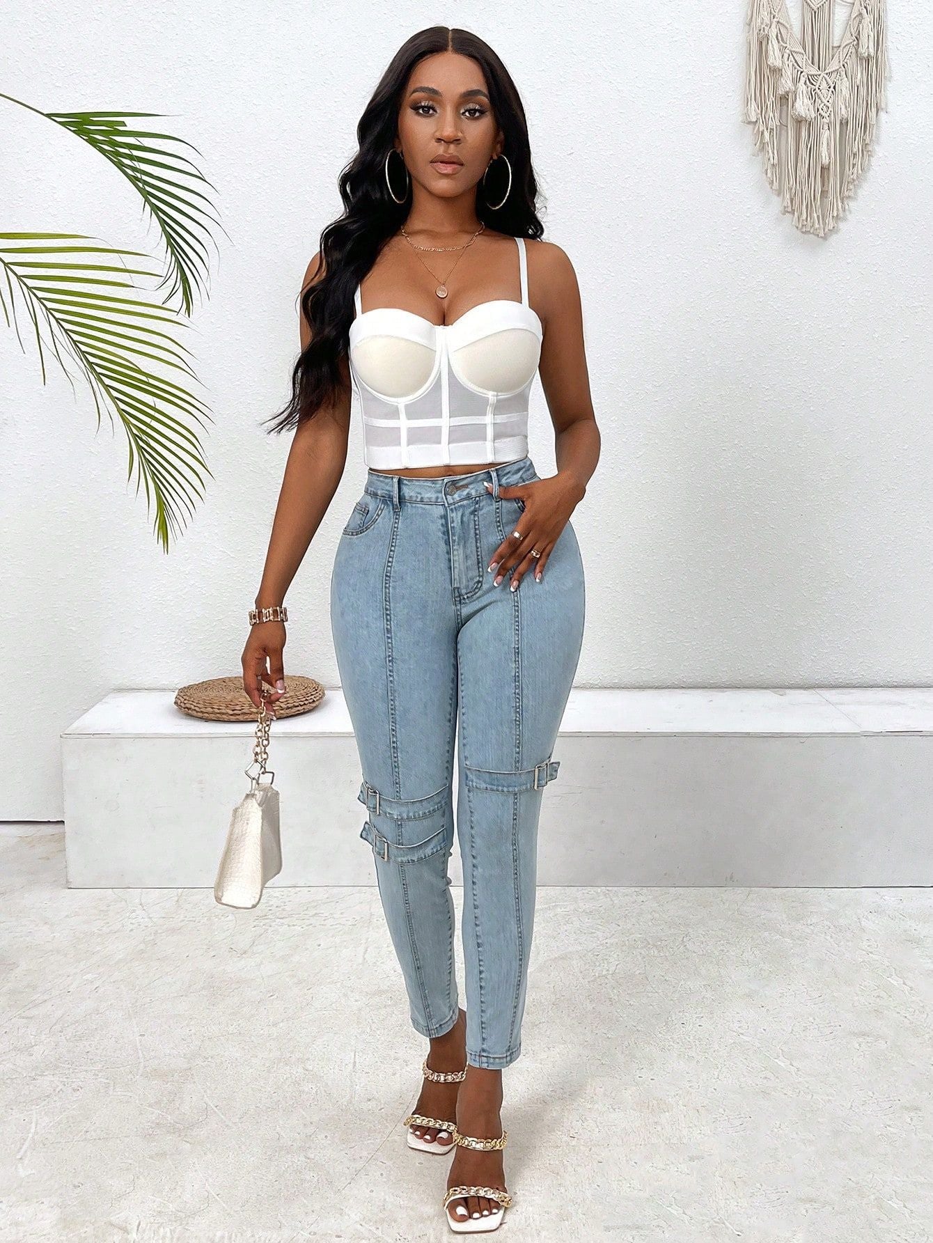 Woman wearing high elastic skinny jeans in white top and light blue denim