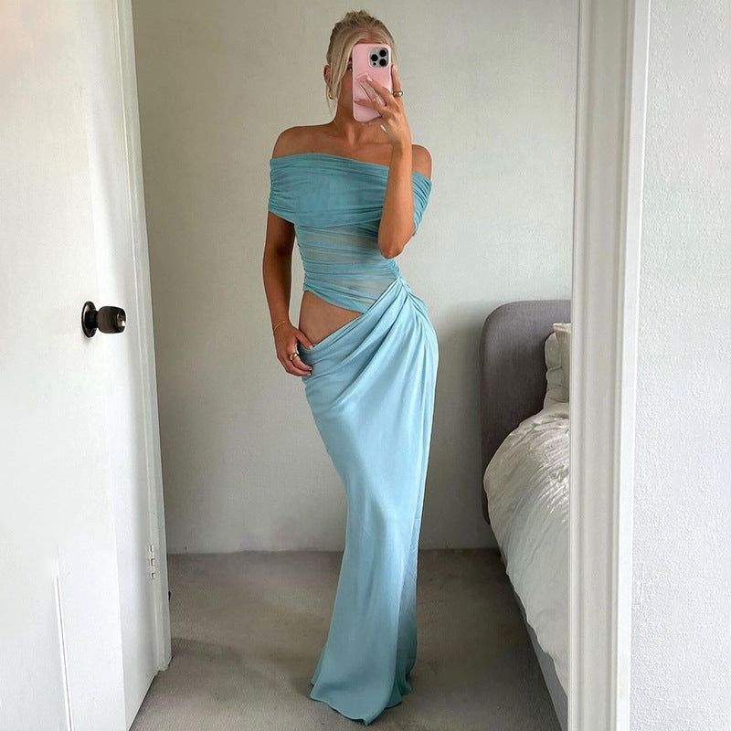 Light blue maxi dress with side cutouts and draped skirt, perfect for evening fashion events