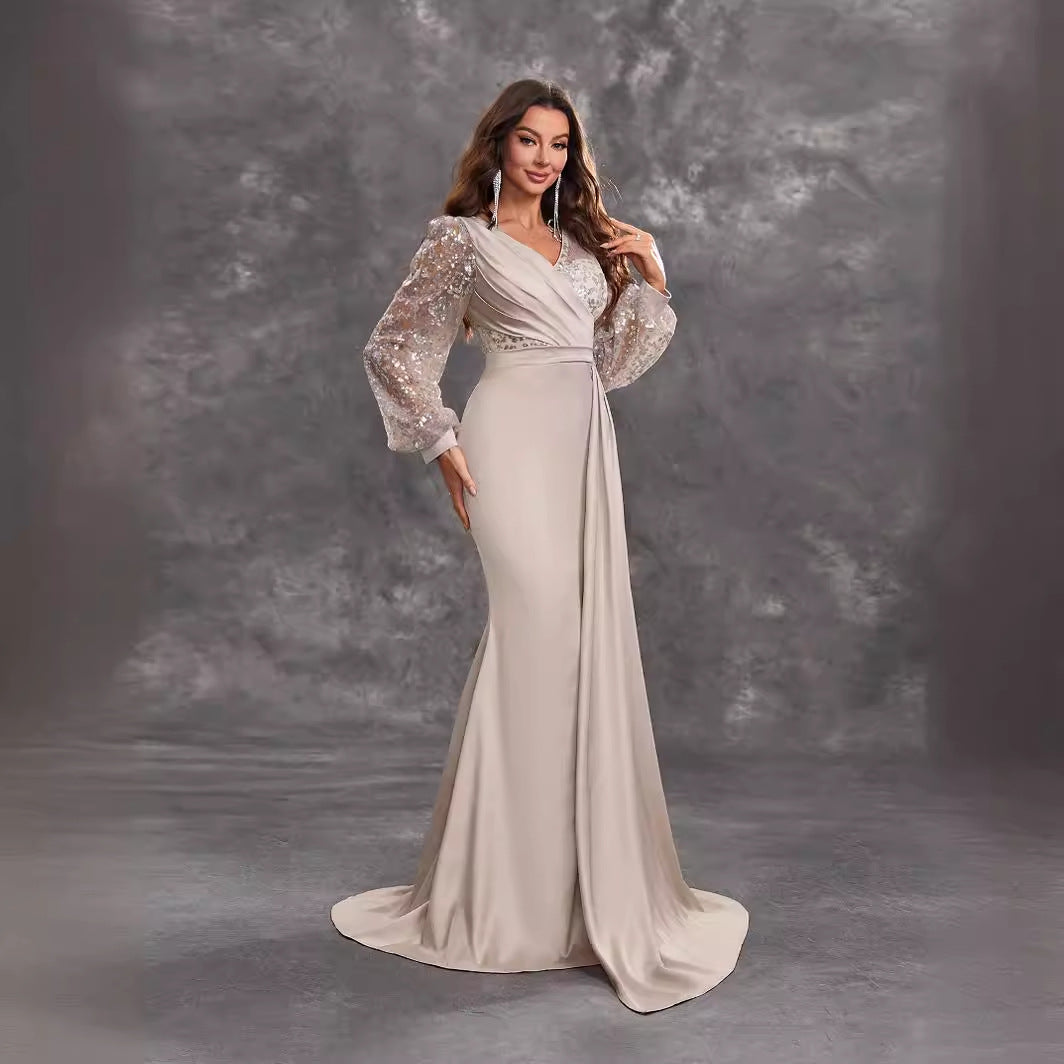 Elegant long-sleeved evening gown showcasing timeless fashion for special occasions
