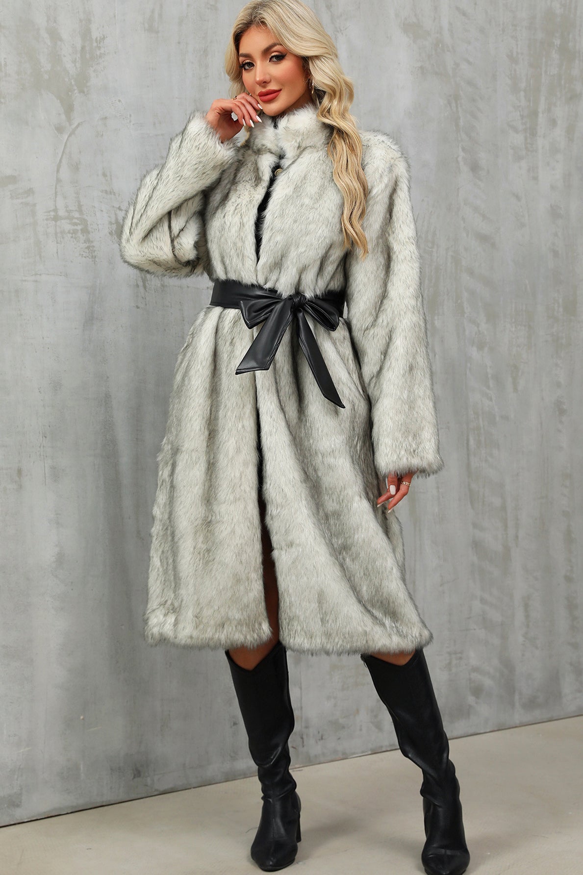 Stylish silver-gray long faux fur overknee coat with high collar and bow belt