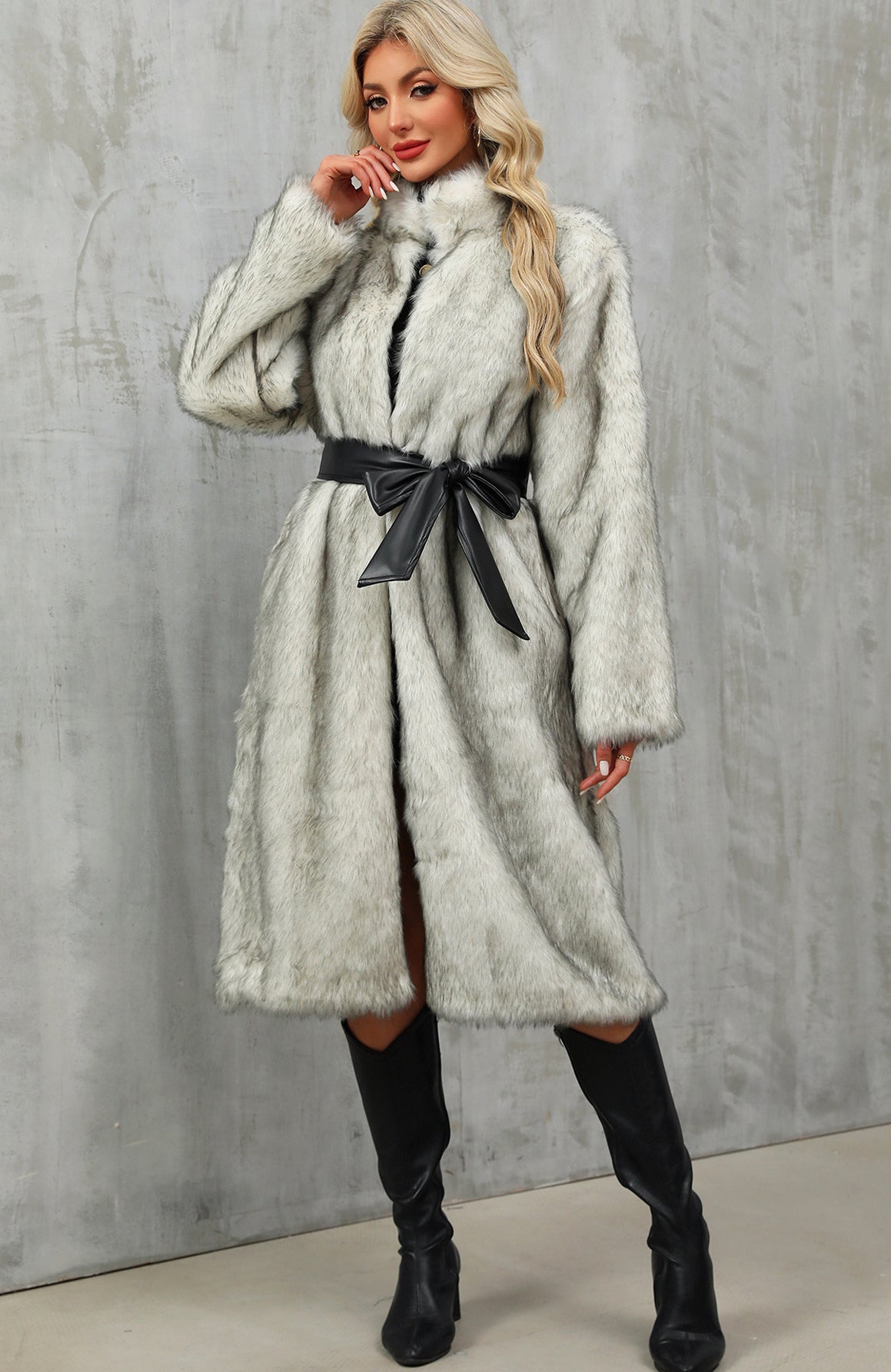 Stylish silver-gray long faux fur overknee coat with high collar and bow belt