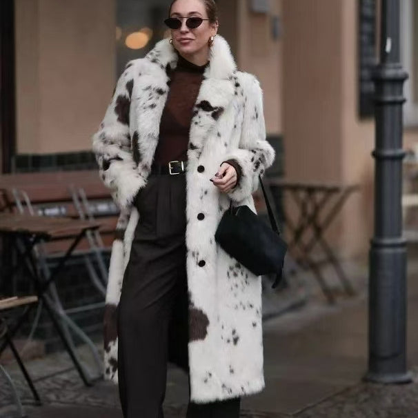 Cozy faux fur long coat in white black cow print with shearling collar