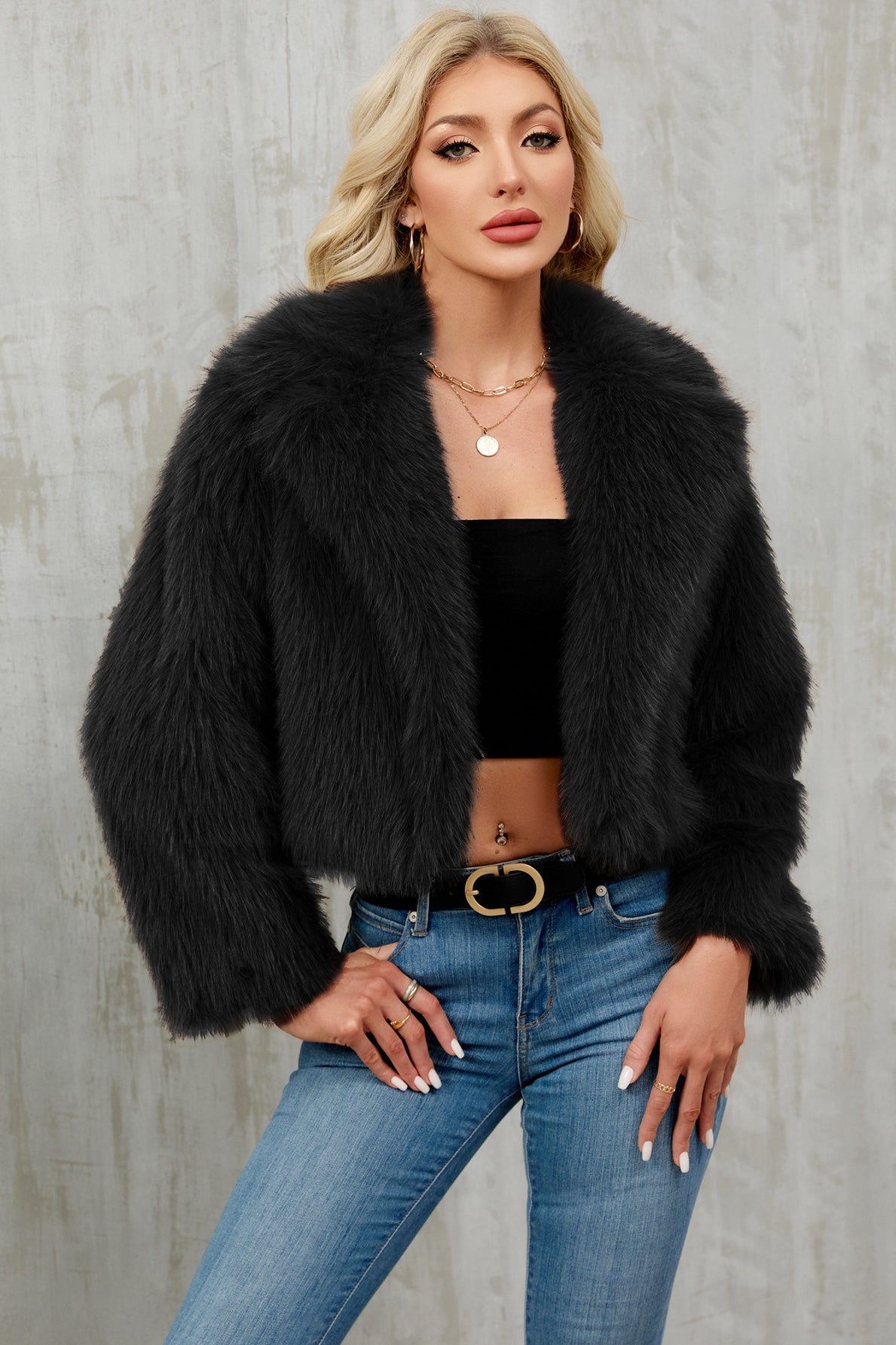 Black faux fur cropped jacket with plush voluminous collar and long sleeves