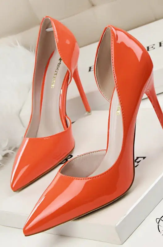 Glossy orange patent leather low cut high heels with pointed toes