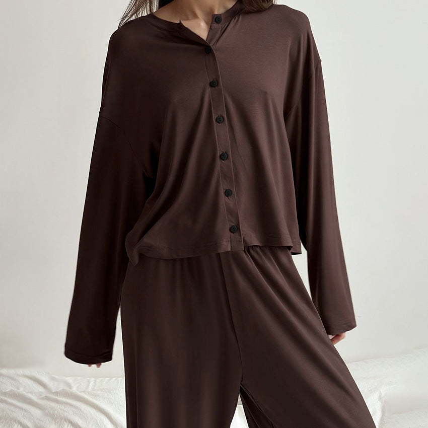Dark brown two-piece loungewear set with long sleeve pants and button-up top