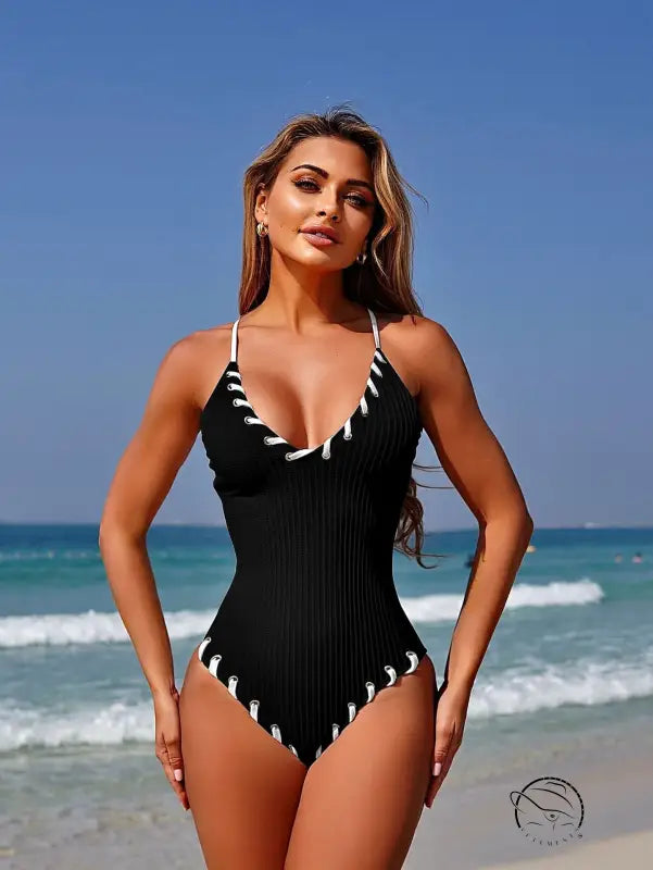 Stunning matching sling black one-piece swimsuit with white stitching