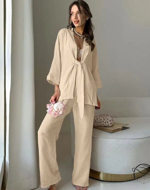Woman in light beige winter pure cotton pajamas set with tie-front top and wide-leg pants