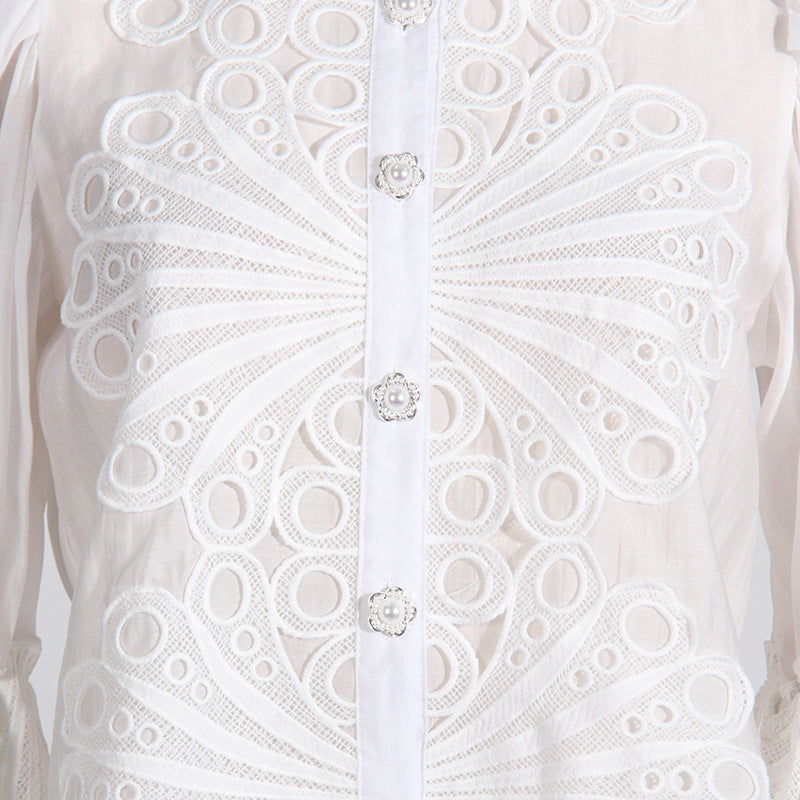 White embroidered blouse with decorative buttons from French Artistic Palace Embroidery Jumpsuit, a stylish langry fashion ملابس