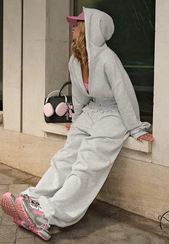 Langry fashion woman in open gray hooded sweatshirt wide leg suit