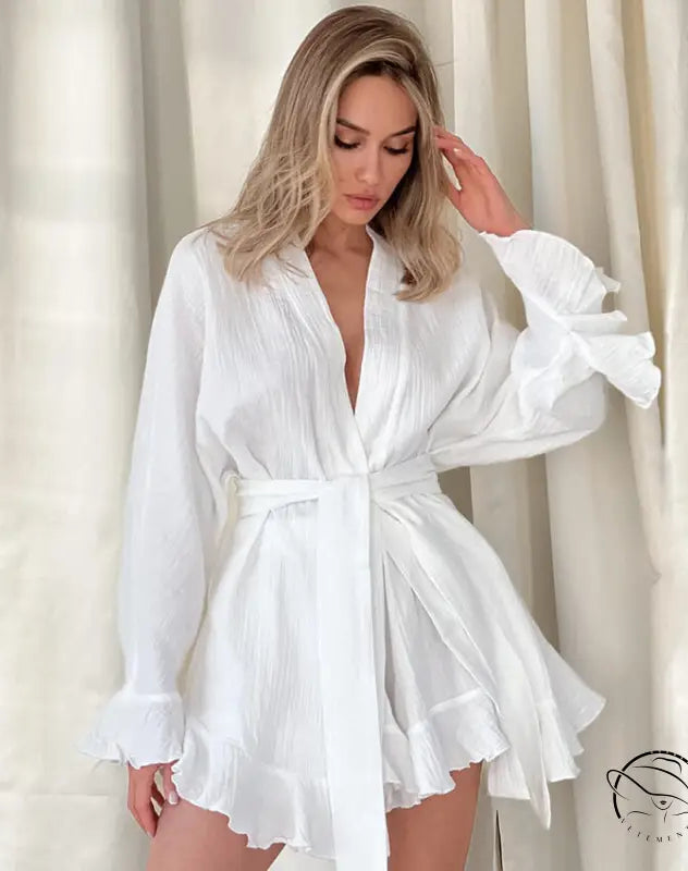 White ruffled belted mini dress in loose shorts ruffled pajamas style