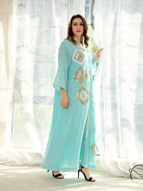Light blue embroidered abaya with gold accents, langry fashion dress