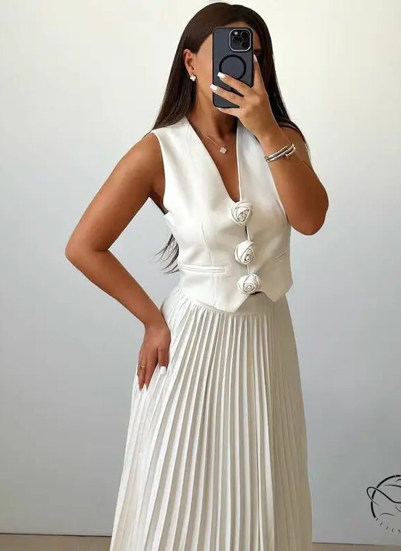 Langry fashion woman in white sleeveless vest and pleated skirt set