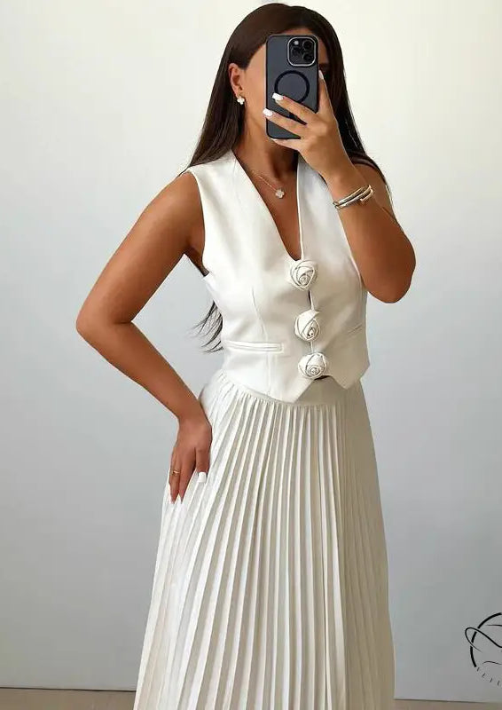 Langry fashion woman in white sleeveless vest and pleated skirt set