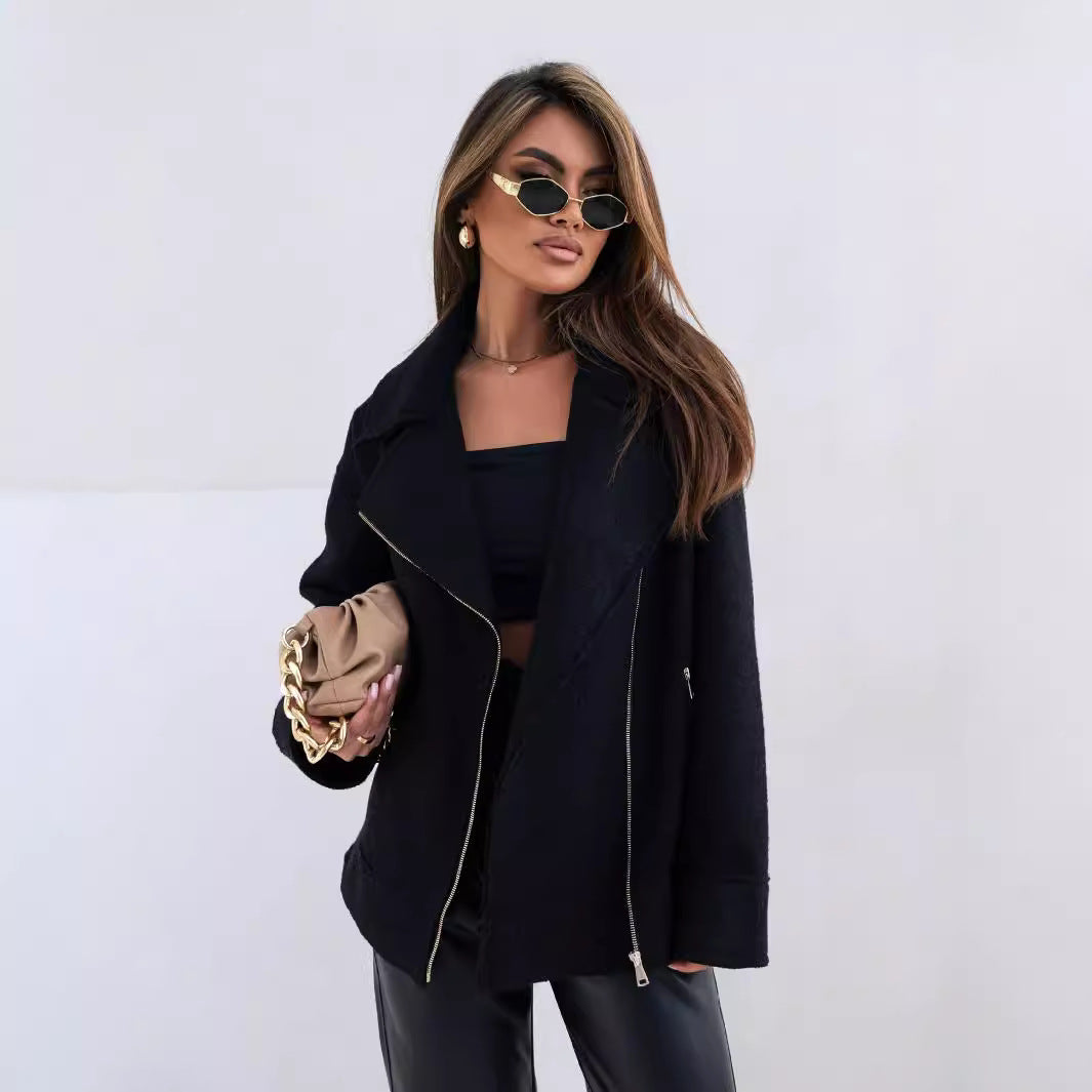Woman in black jacket with gold accents, showcasing Langry fashion for ملابس elegance