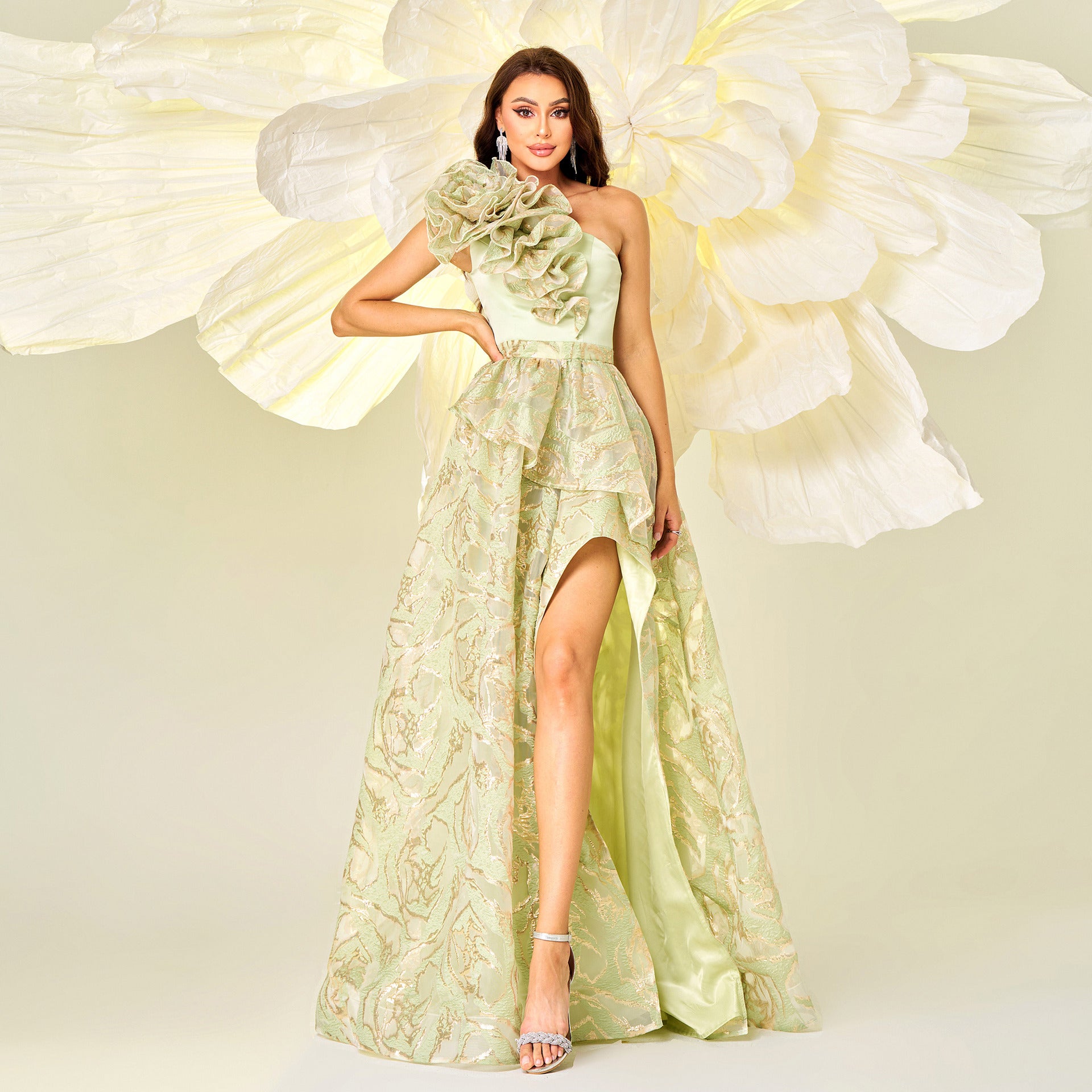 Woman in a one-shoulder floral gown showcasing high-end evening dress fashion ملابس
