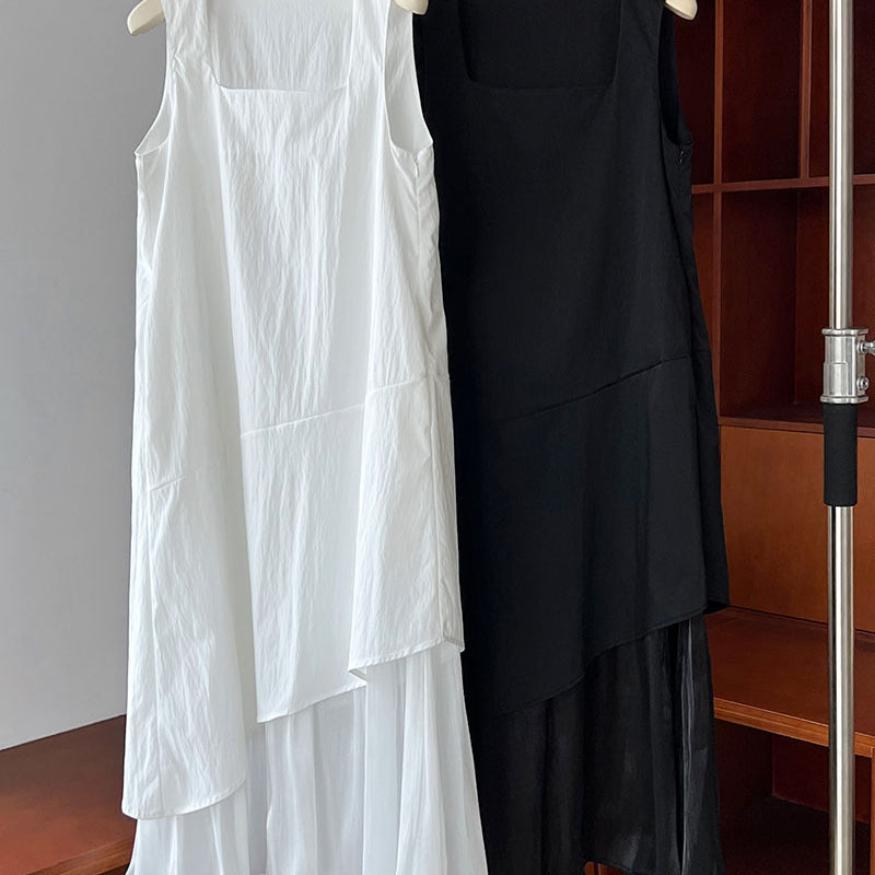 Two elegant Korean style dresses in white and black hanging side by side