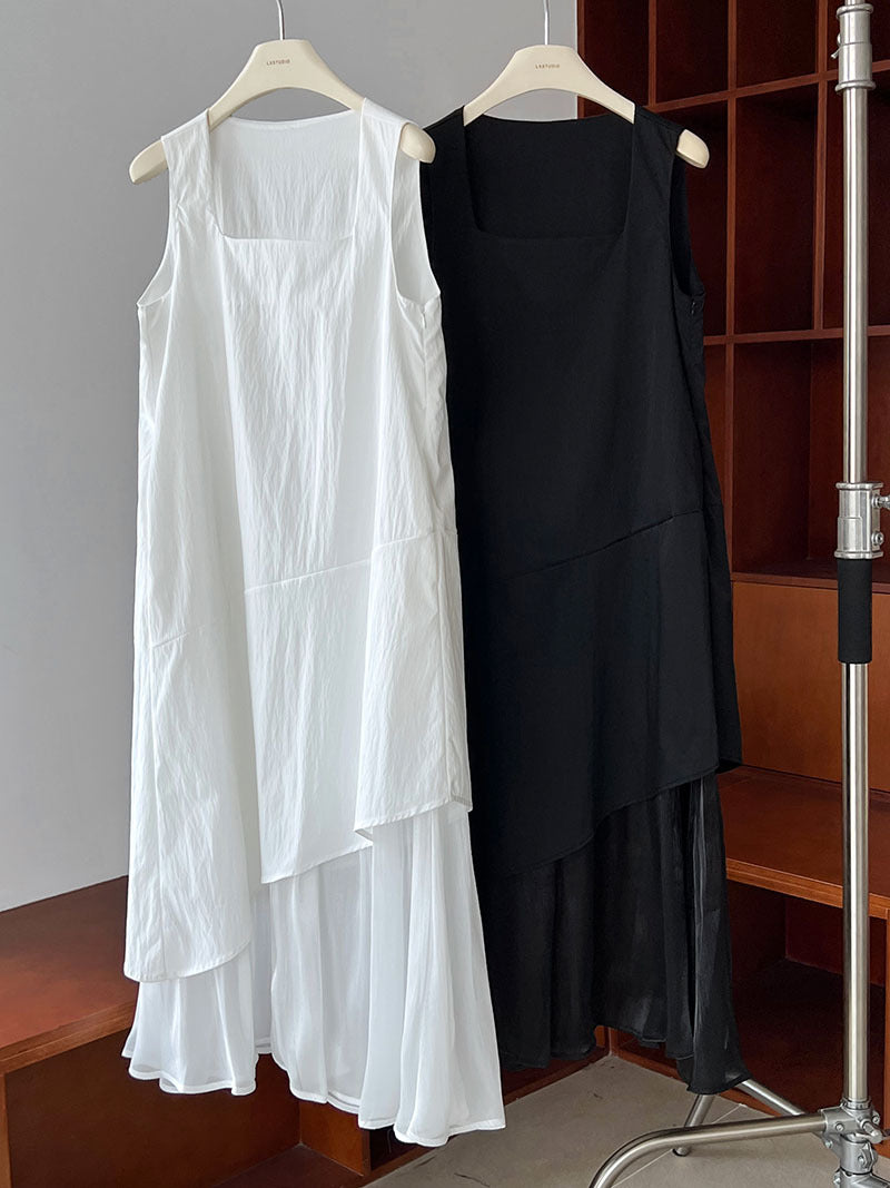 Two elegant Korean style dresses in white and black hanging side by side