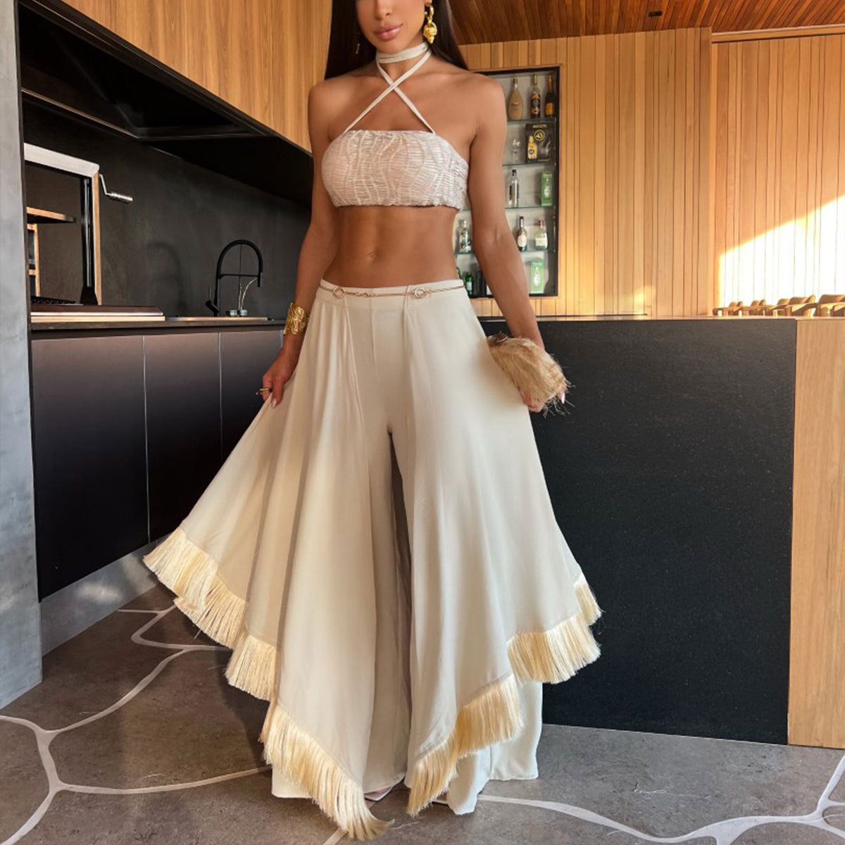 Woman’s two-piece halter top and palazzo pants set, a stunning fashion choice in ملابس