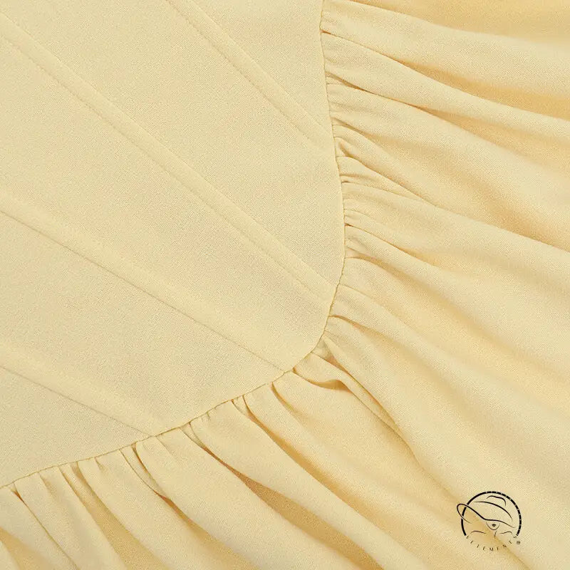 Elegant langry fashion maxi dress with cream ruffled bed skirt edge