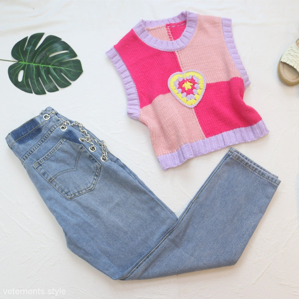 Pink, light pink, and purple knit vest with crocheted heart appliqué for Chain Straight Jeans