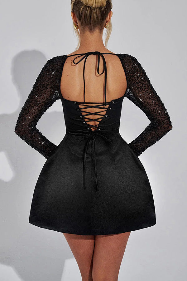 Black long-sleeved Casual Meeting Dress with lace-up back, a stylish fashion choice