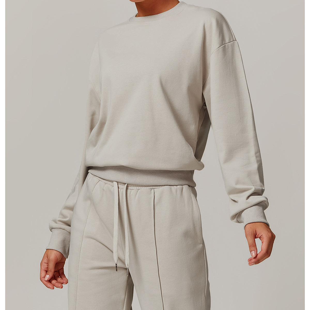Loose Round Neck Sports Sweater in a matching gray sweatshirt and pants set for fashion enthusiasts