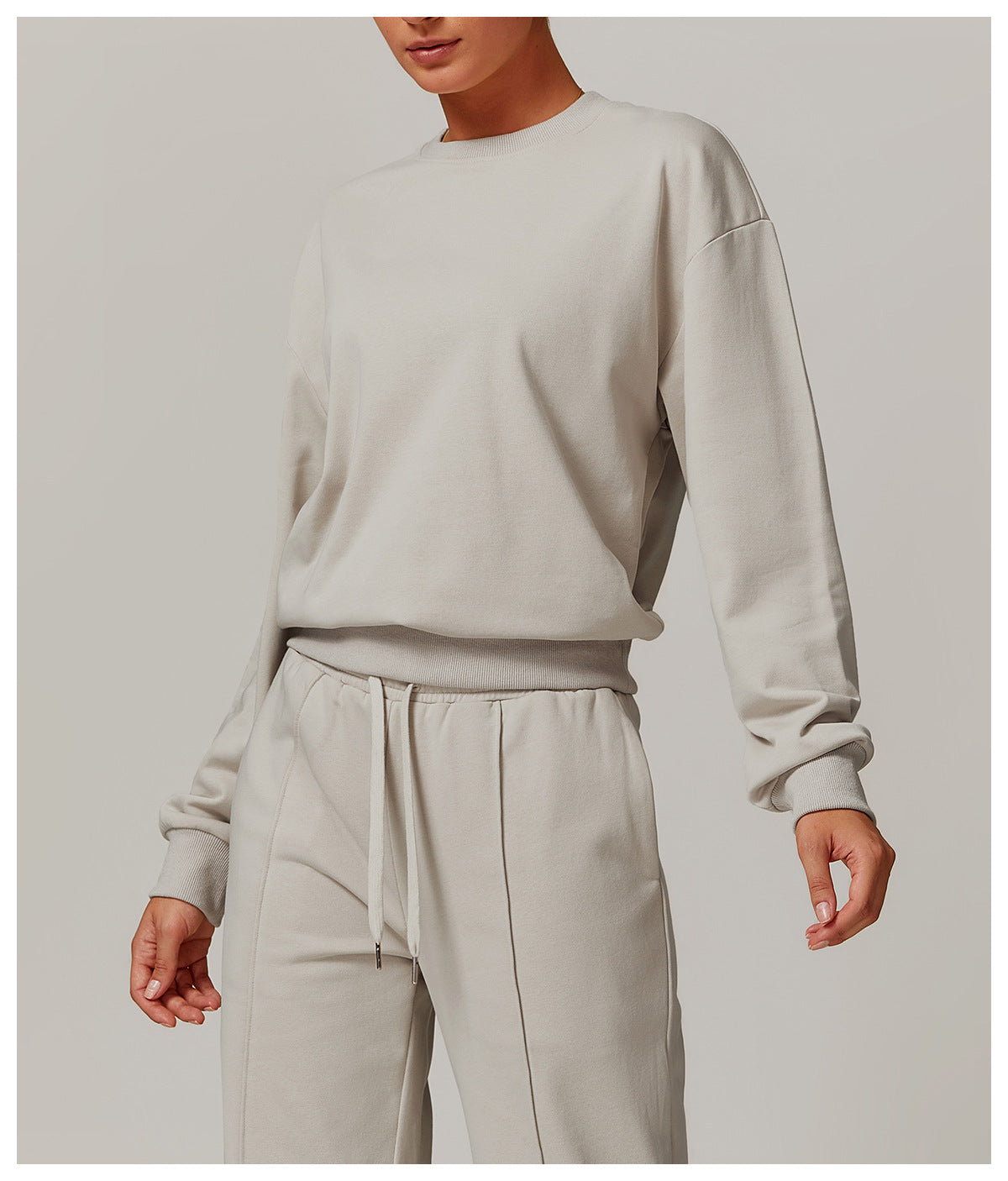 Loose Round Neck Sports Sweater in a matching gray sweatshirt and pants set for fashion enthusiasts
