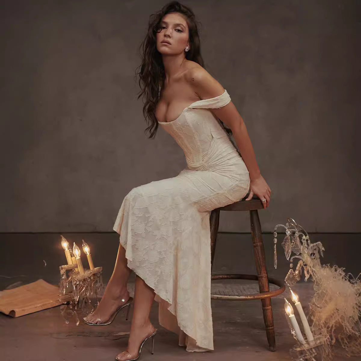 Elegant off-shoulder cream cami dress with fitted bodice and flowing skirt for formal fashion