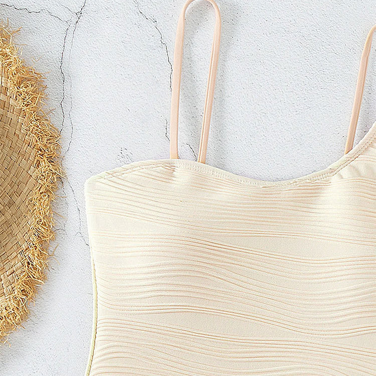 Cream-colored textured swimsuit showcasing a solid color push-up design