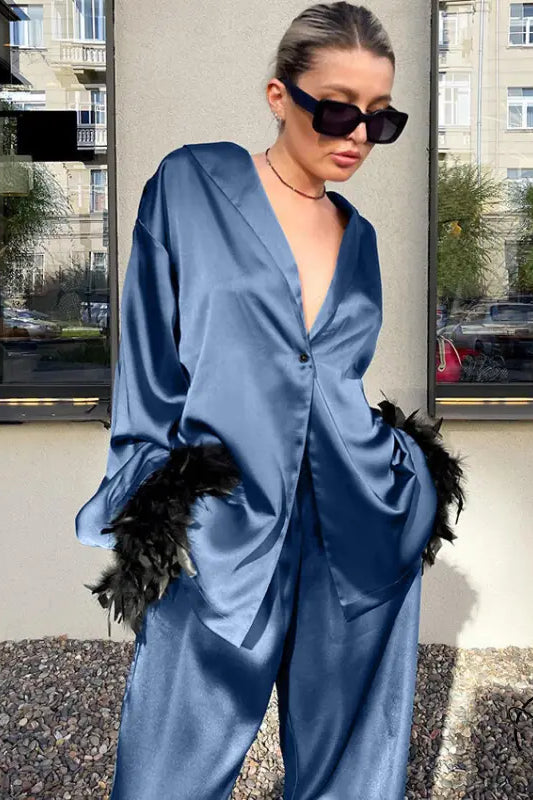 Langry blue satin jumpsuit with feather accents in fashion pajamas set