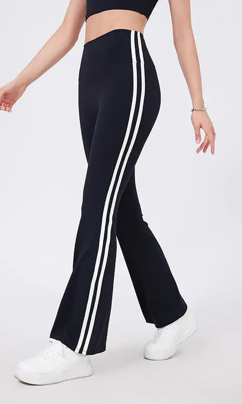 Black high waist yoga pants with white stripes and peach hip raise