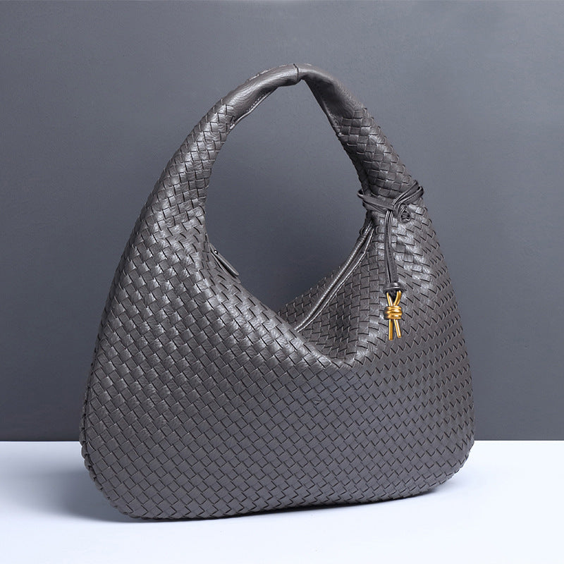Gray woven leather hobo bag, a stylish accessory for casual shoulder bag enthusiasts in fashion
