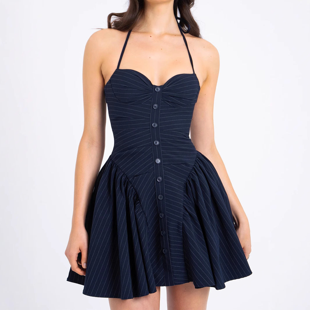 Navy blue halter dress with buttons and pleated skirt, a stunning piece in fashion ملابس