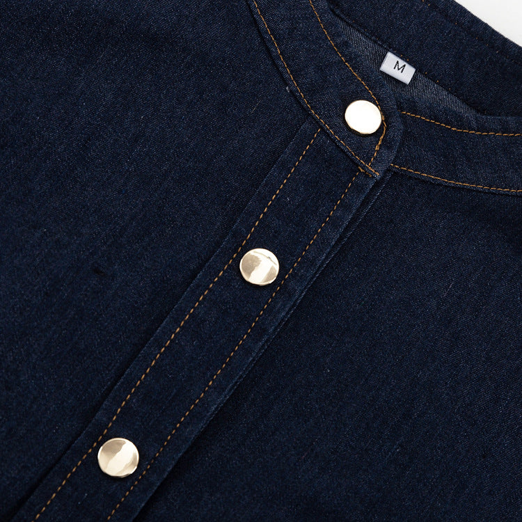 Dark blue denim shirt with band collar and gold snap buttons for fashionable dress style