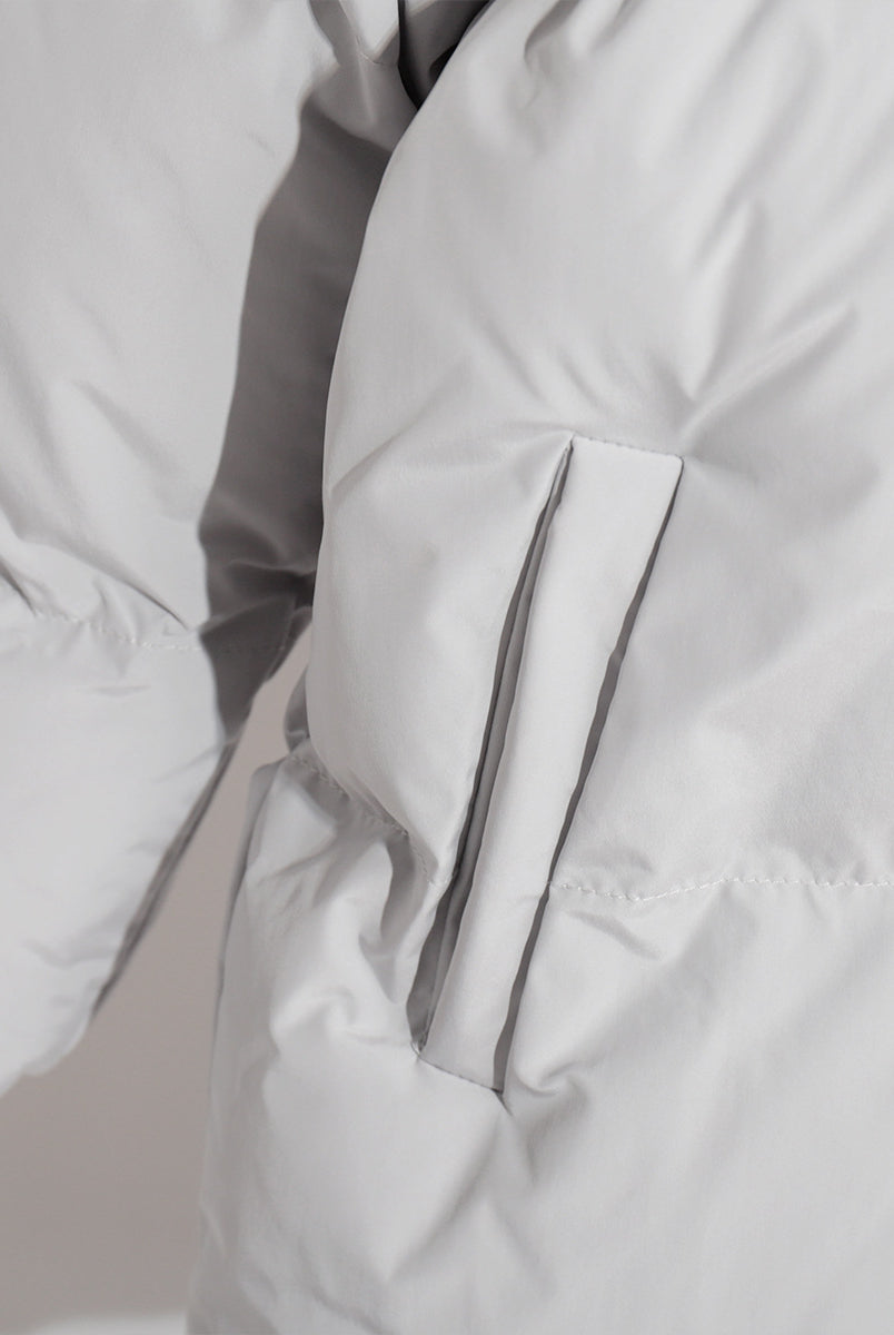 Detail of a White Puffer Jacket from the Cotton Coat Jacket collection in fashion ملابس