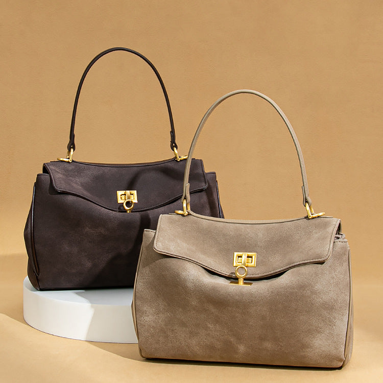 Two stylish suede handbags with gold clasps from Original Frosted Deerskin Bag fashion collection
